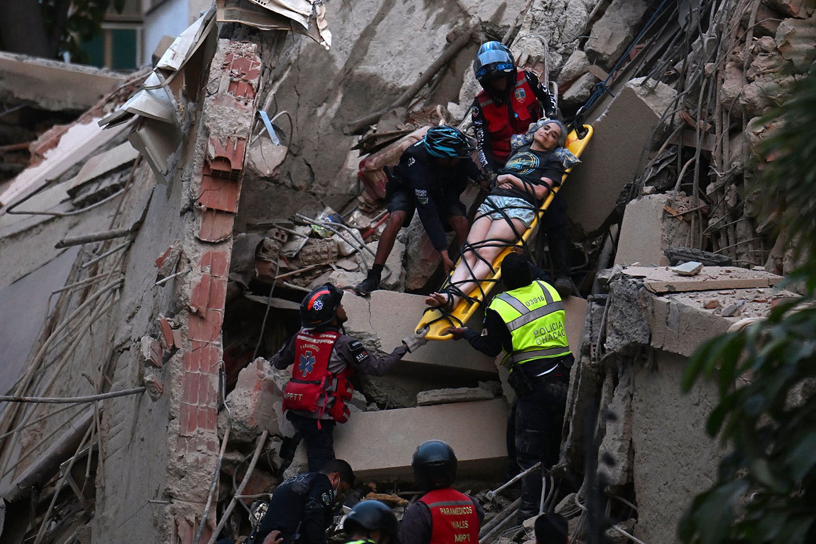 Emergency crews conduct search-and-rescue operations after a major South American earthquake